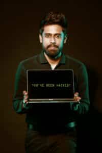 Free Man Holding Laptop Computer With Both Hands Stock Photo